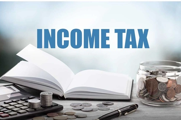 A person using a laptop in a library setting, with a Payplex sign in the background